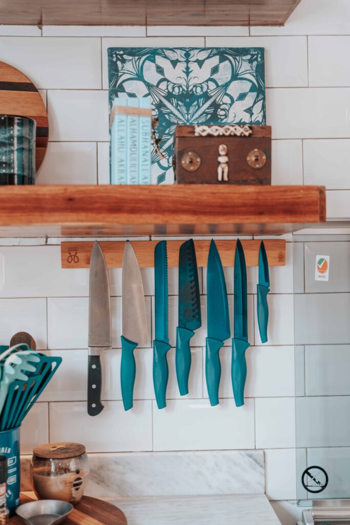 Magnetic knife strip mounted on kitchen wall